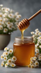 Wooden honey dipper dripping golden honey