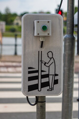 Pedestrian crossing button on the embankment in Deventer, Netherlands. High quality photo.