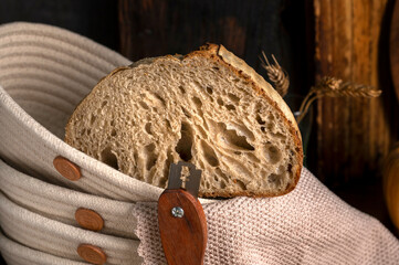 Healthy, organic, whole and sliced ​​homemade sourdough bread with ham and cheese on a wooden...