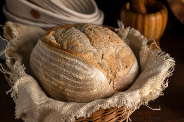 Healthy, organic, whole and sliced ​​homemade sourdough bread with ham and cheese on a wooden...