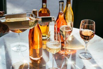 Different types of wine in glasses - red, white, rose and amber. Wine tasting in a bar or restaurant.