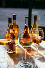 Different types of wine in glasses - red, white, rose and amber. Wine tasting in a bar or restaurant.