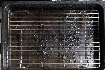 dirty grill with black grease