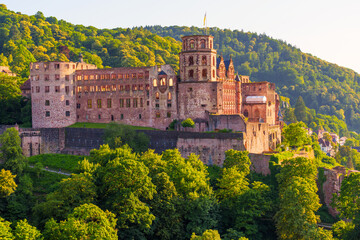 Historic Heidelberg Castle Surrounded By Lush Greenery At Sunset