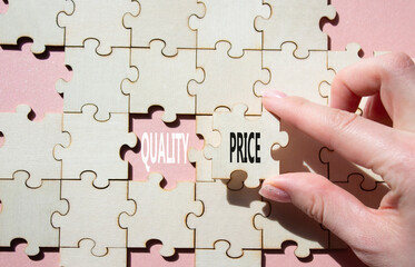 Price or Quality symbol. Concept word Price or Quality on wooden puzzle. Businessman hand....