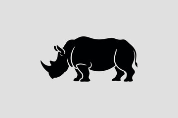 Strong Black Silhouette of a Rhinoceros Standing Proudly Against a Light Gray Background Depicting Wildlife and Nature Conservation in a Minimalist Style