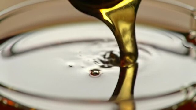 Golden Syrup Flowing Richly Fills The Container Detail