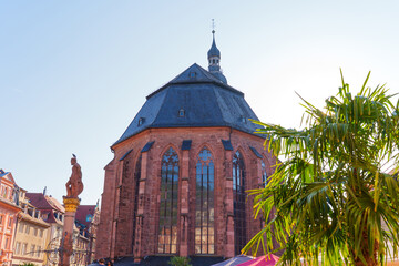 Historic Gothic Church Tower with Palm Trees in Heidelberg Germany