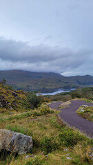 Curving Pathway and Misty Lake View in the Gap of Dunloe, Ireland