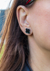Shot of the popular earring design shaped as a four leaved clover. Fashion