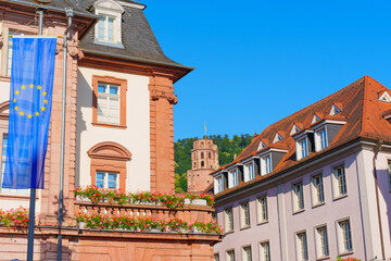 Naklejka premium Historic Architecture in Heidelberg with European Flag and Castle View