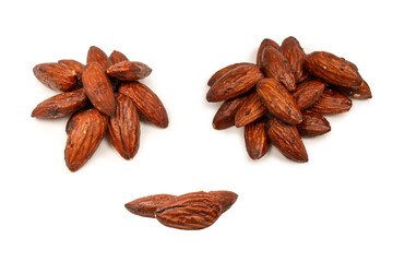 A group of caramelized almonds isolated on a white background.