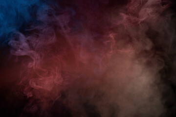 Blue and pink steam on a black background.
