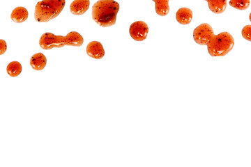 Red jam splashes isolated on a white background.