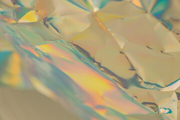 An abstract, vibrant image with reflective kaleidoscopic patterns, suggestive of modernity or luxury