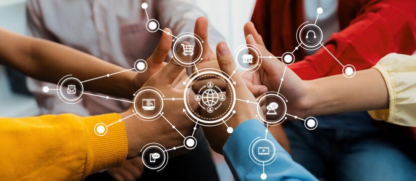 Hands of diverse individuals connecting together to symbolize teamwork and innovation, surrounded by digital icons representing modern collaboration and communication themes. Amity