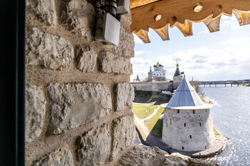 Rough-cut stone window opening in a medieval fortress tower with thick masonry and visible texture....