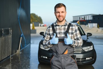 Portrait of a car wash station worker.