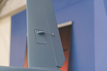Aerial view of a single-engine propeller plane against cloudy sky, emphasizing motion and broad...