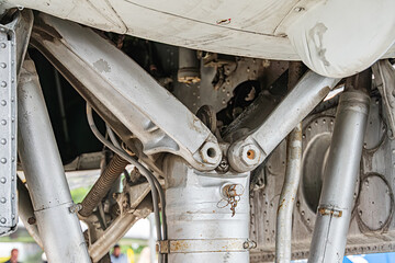 Close-up of an industrial mechanical assembly, steel or alloy parts, rivets, fasteners, wear and...