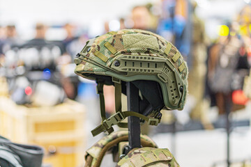 Indoor military expo scene featuring a mannequin in advanced armor with high-tech helmet,...