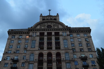 Architectural Building with Star on Top Under Cloudy Sky