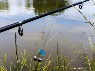 Fishing rod with a bell attached to it