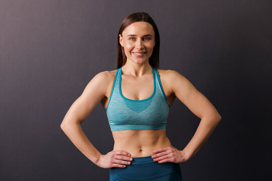Fototapeta Portrait of professional trainer on black background
