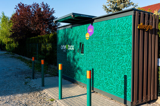 15.06,2025 in Wroclaw, Poland. Allegro One Box self-service parcel locker with floral design for smart deliveries seen. Concept of e-commerce, eco delivery and urban logistics.