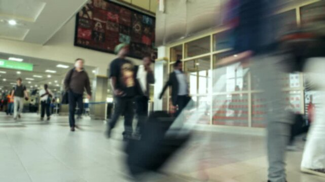 Time lapse clip of people passing inside terminal in the airport