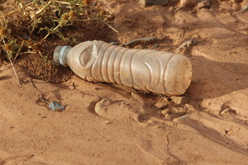 Plastic bottle lying on the ground