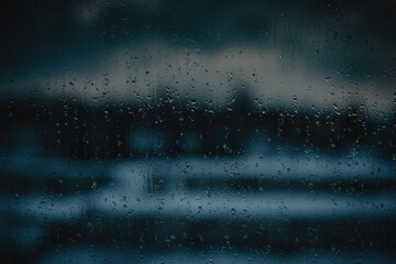 RAIN DROPS ON DARK GLASS