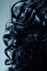 Fototapeta premium Close-up of curly black hair isolated -