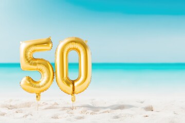 Golden 50 number balloons on tropical beach sand – milestone birthday celebration and summer vacation concept