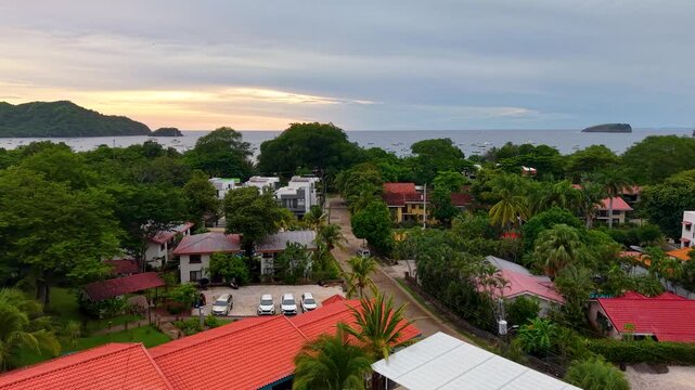 Aerial footage of Playas del Coco, Costa Rica &mdash; golden beaches, lush hills, and a scenic bay filled with yachts, perfect for tourism, ocean adventures, and tropical getaways
