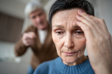 Portrait of depressed woman exhausted from dealing with husband hysterics in troubled marriage....