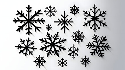 A graphic illustration featuring a collection of black, stylized snowflakes on a stark white background