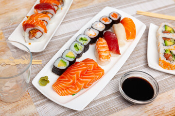 Variations of sashimi and sushi with soy sauce on table, Japanese cuisine delicases.