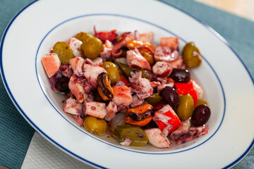 Traditional Spanish seafood salpicon - cold salad from mix of seafood and vegetables