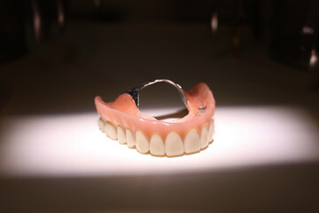 render of mandibular prosthesis all on 4 system supported by implants over white background