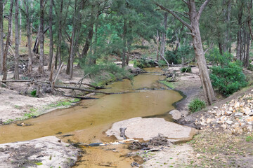 Photograph of the Capertee River at very low levels running through the Capertee Valley after major flood damage in the Wollemi National Park in NSW, Australia.