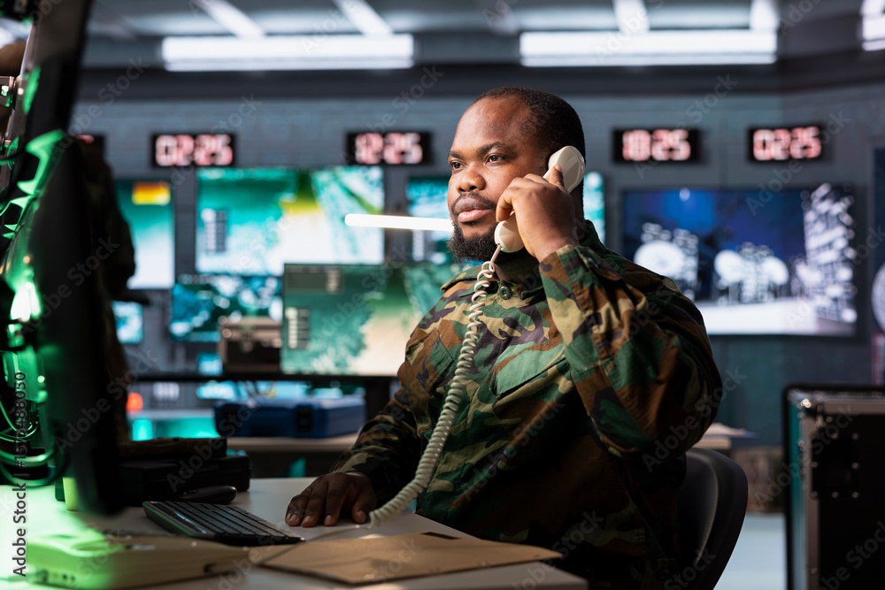Poster military officer collaborating with general on telephone call to deploy electronic warfare tools dis