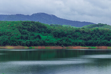 beautiful landscape scenery with lake and green forest mountain in kerala