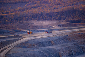 Autumn Mining Operations: Heavy Machinery in Scenic Forest Landscape