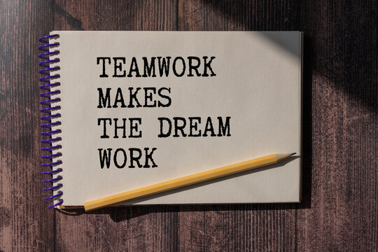 Teamwork Makes The Dream Work text on notepad, concept background.