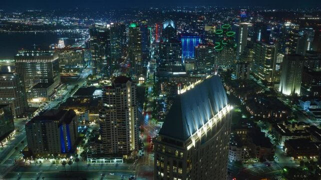 Immerse yourself in the aerial views of Downtown San Diego at night, with its illuminated skyline and lively streets, reflecting a vibrant nightlife and enticing entertainment options