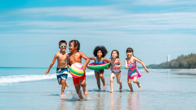 children, kids, summer, beach, sea, playing, fun, girl, boy, diversity, ocean, travel, vacation, asian, black people, blue, cheerful, child, childhood, family, friends, friendship, group, happiness, h - Powered by Adobe