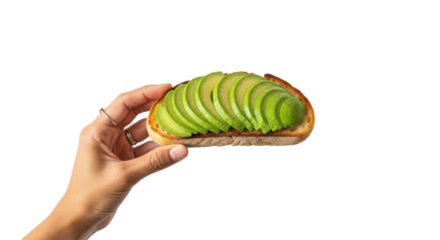 A hand holding a piece of toast topped with sliced avocado against a black background studio shot