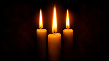 three candles on black background
