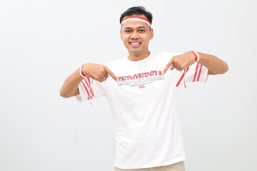 Indonesian man celebrating the independence day of the Republic of Indonesia, smiling looking at...